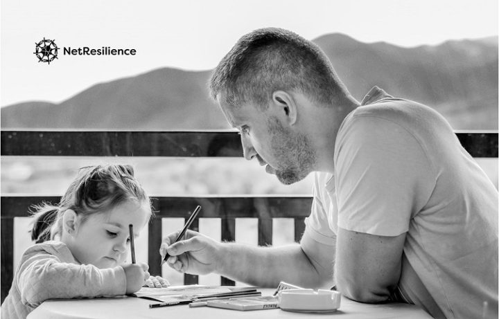 Father and daughter drawing together